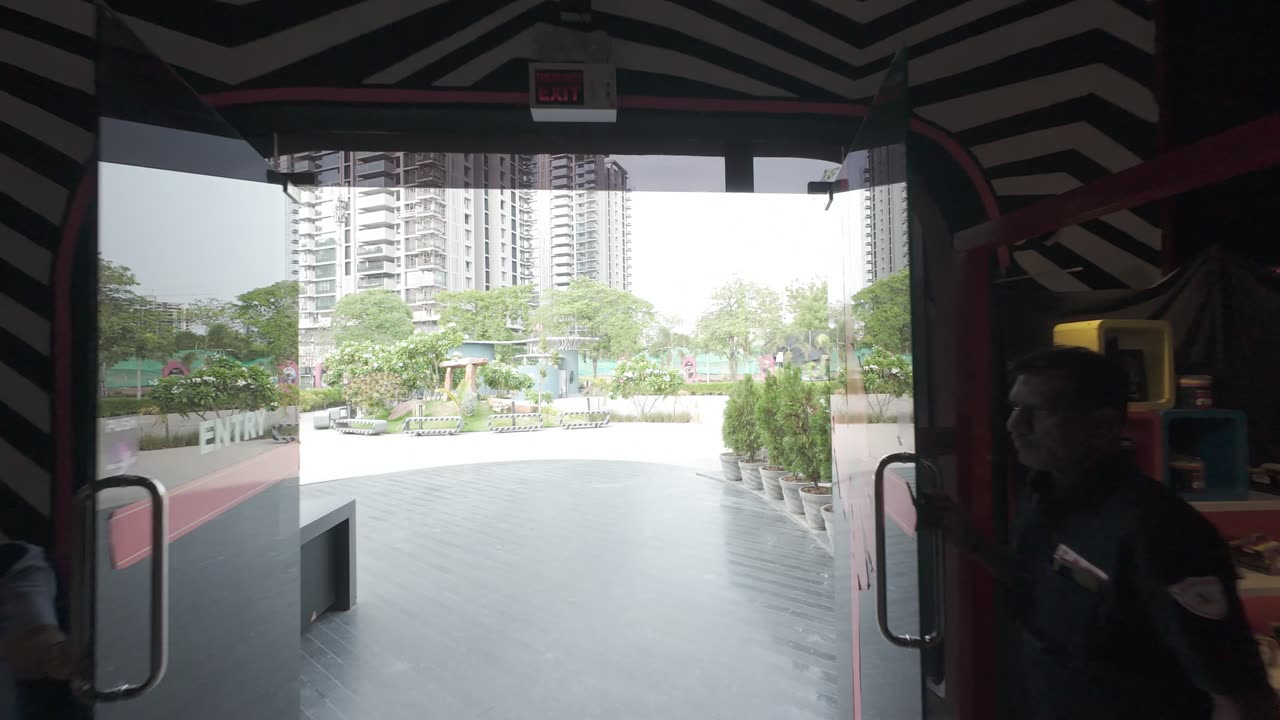 Looking out through the zebra-striped entrance toward the city