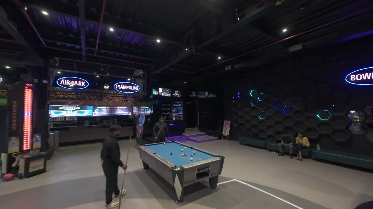 Pool tables on the walkway between the AirPark, trampoline and bowling zones